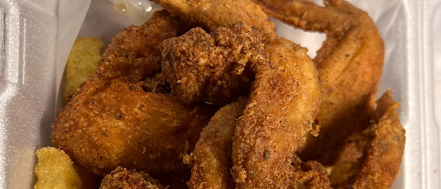 Golden breaded whole wings, crispy and fresh out of the fryer
